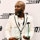 The Root’s Michael Harriot, cradling dual awards at the 2019 NABJ Awards.
